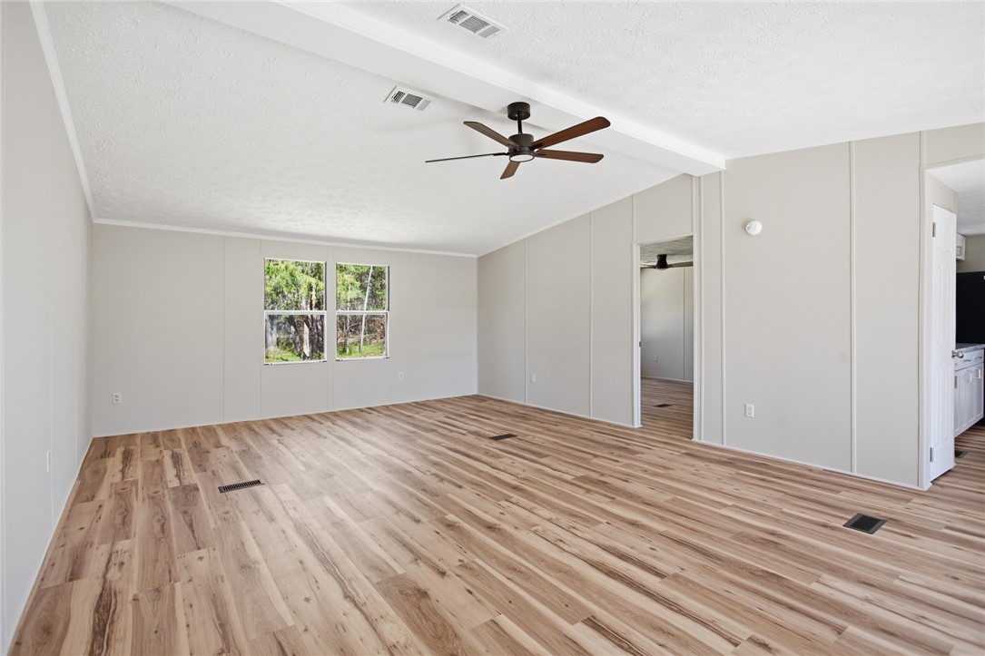 202 Greenbriar Drive Seneca, SC 29678 - Photo 13 of 37 This bright living space features wood flooring and large windows, creating an inviting atmosphere.