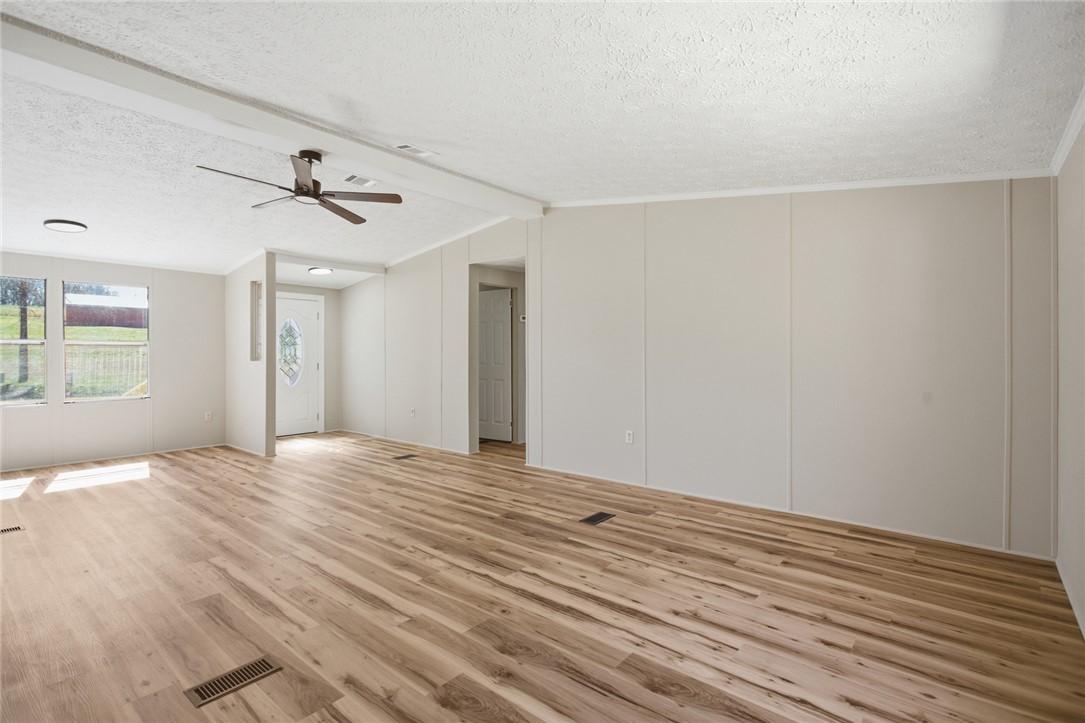 202 Greenbriar Drive Seneca, SC 29678 - Photo 15 of 37 This airy living area features sleek wood flooring, a ceiling fan, and abundant natural light.