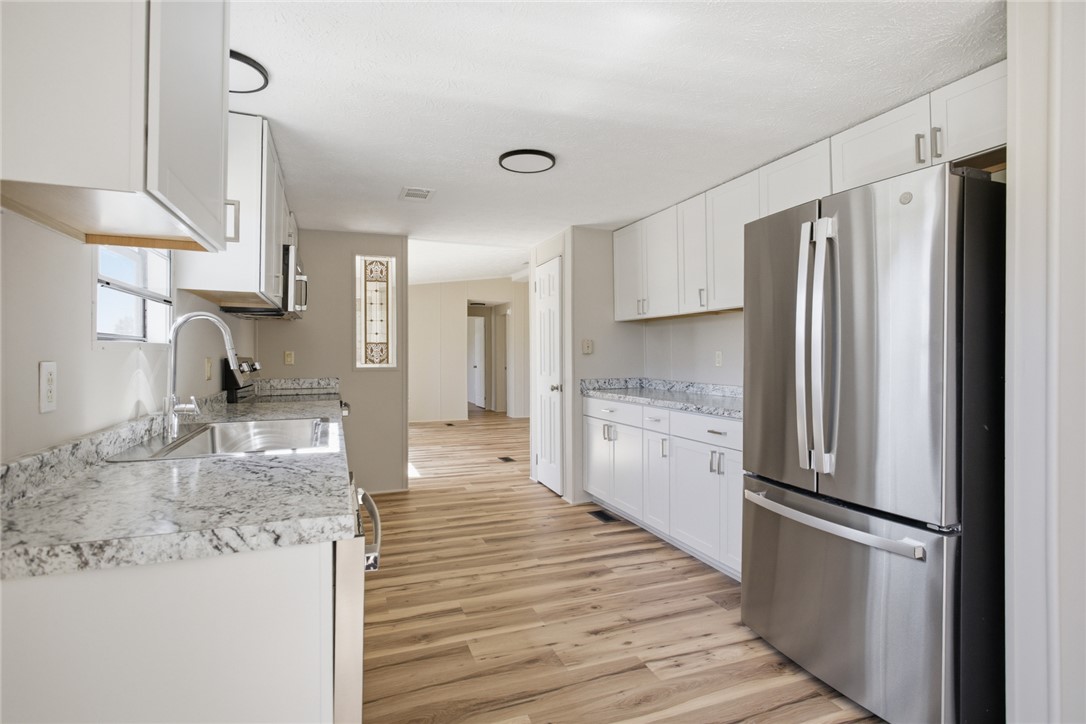 202 Greenbriar Drive Seneca, SC 29678 - Photo 22 of 37 This bright kitchen features ample counter space and modern appliances, perfect for everyday living.