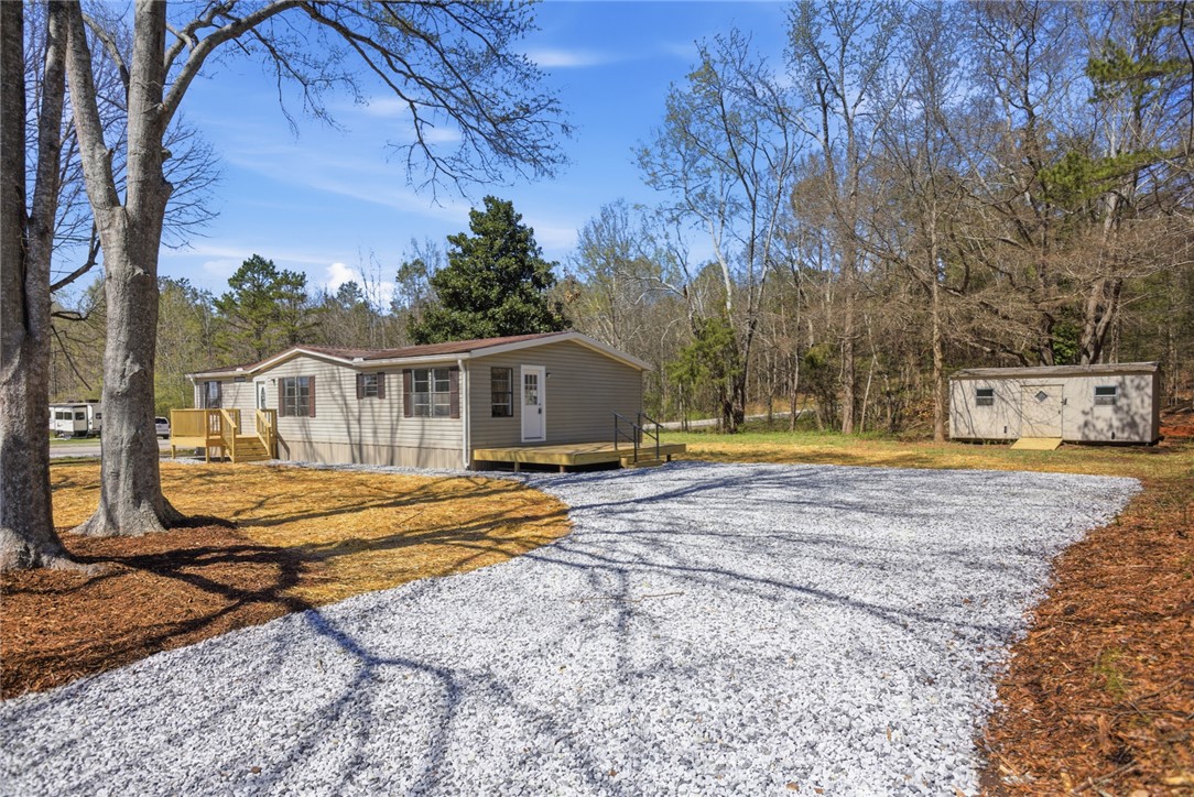 202 Greenbriar Drive Seneca, SC 29678 - Photo 3 of 37 This inviting home offers tranquil living amidst natural surroundings.