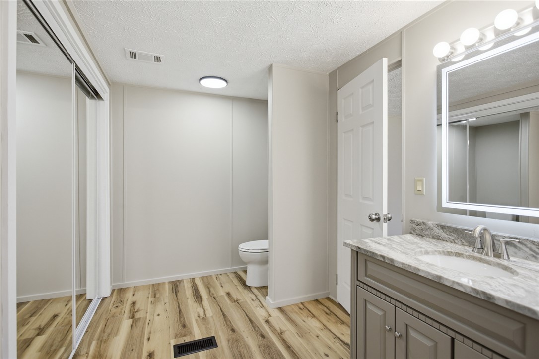 202 Greenbriar Drive Seneca, SC 29678 - Photo 31 of 37 This bright bathroom features a stylish vanity, a contemporary toilet area, and ample closet space.