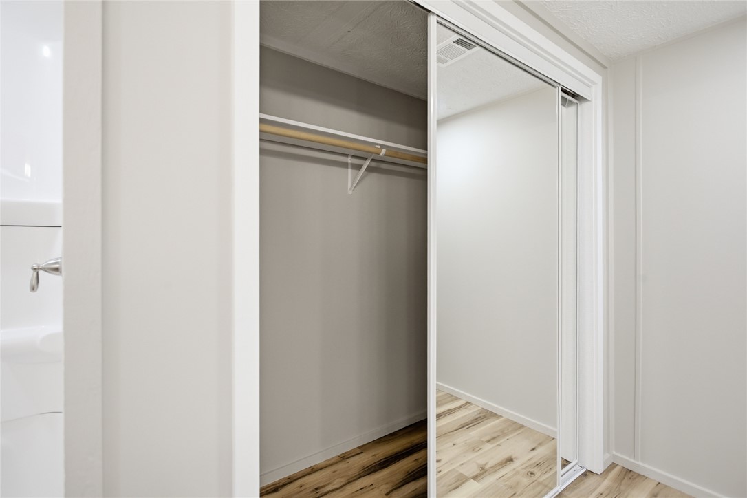202 Greenbriar Drive Seneca, SC 29678 - Photo 32 of 37 This functional closet offers ample storage with mirrored sliding doors and warm flooring.
