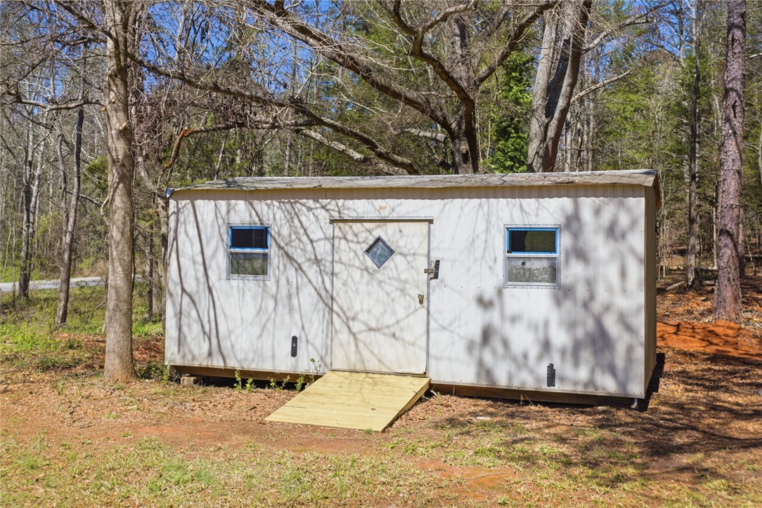202 Greenbriar Drive Seneca, SC 29678 - Photo 5 of 37 This versatile outdoor structure offers convenient storage and utility amidst a natural, wooded setting.