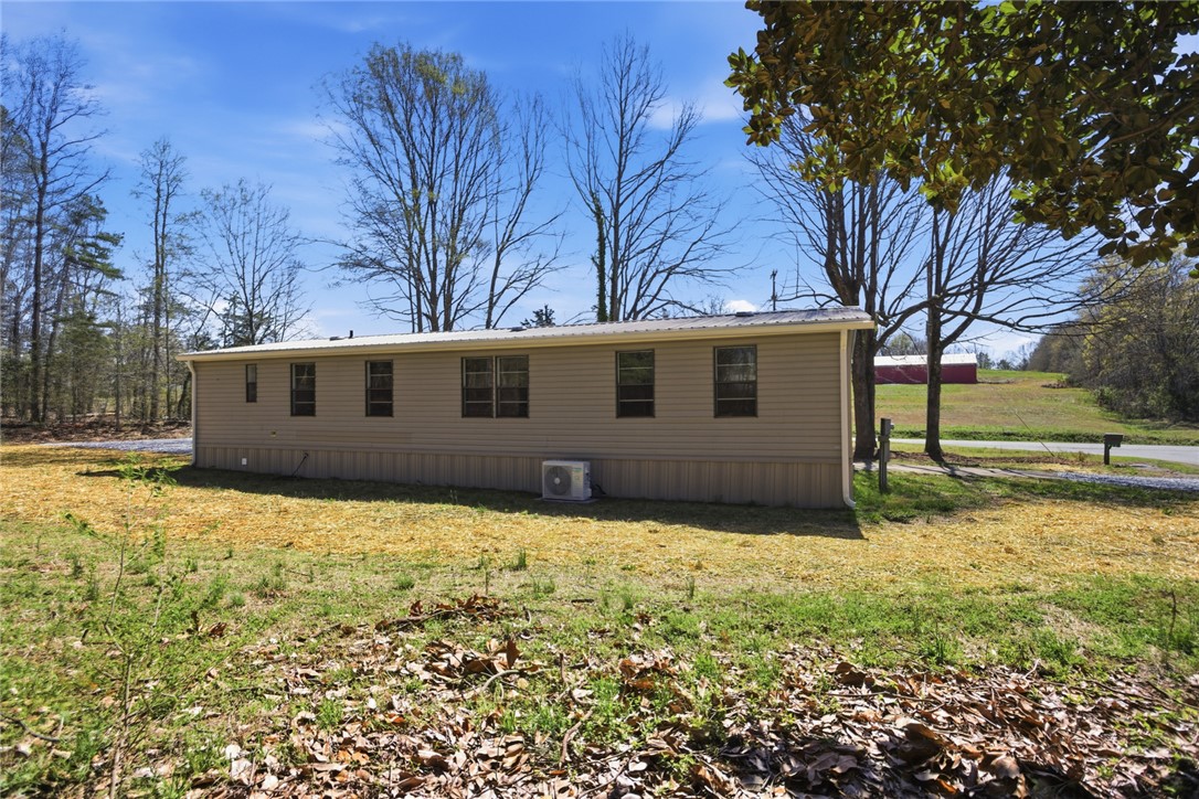 202 Greenbriar Drive Seneca, SC 29678 - Photo 8 of 37 This manufactured home is nestled on a spacious lot, surrounded by natural beauty and open skies.