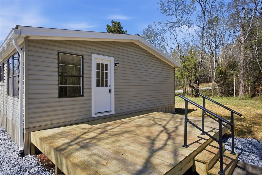202 Greenbriar Drive Seneca, SC 29678 - Photo 9 of 37 This charming home features a lovely outdoor deck, perfect for enjoying the peaceful natural surroundings.