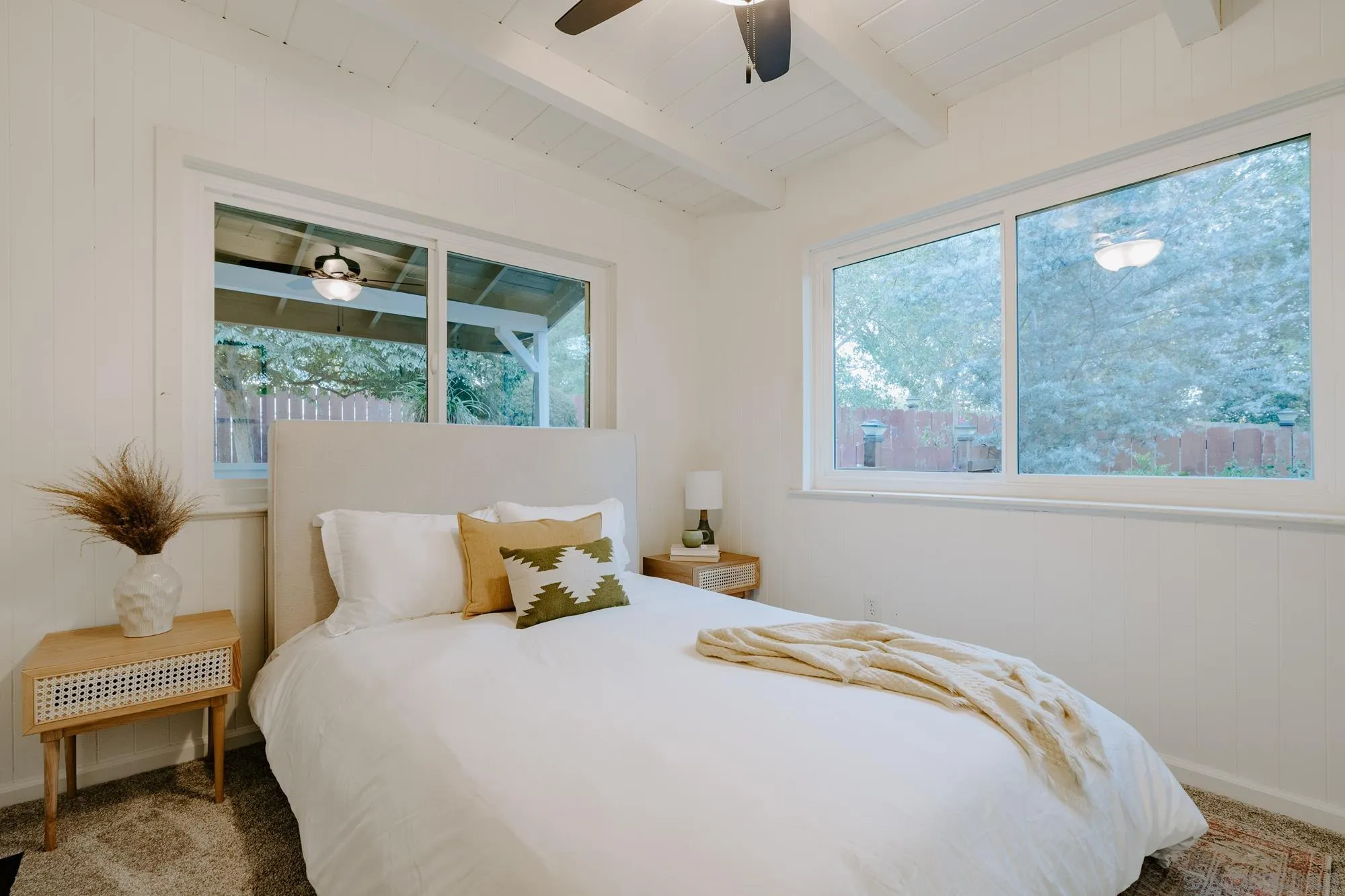 1560 South Grade Road Alpine, CA 91901 - Photo 22 of 48 a bedroom with a bed and large windows