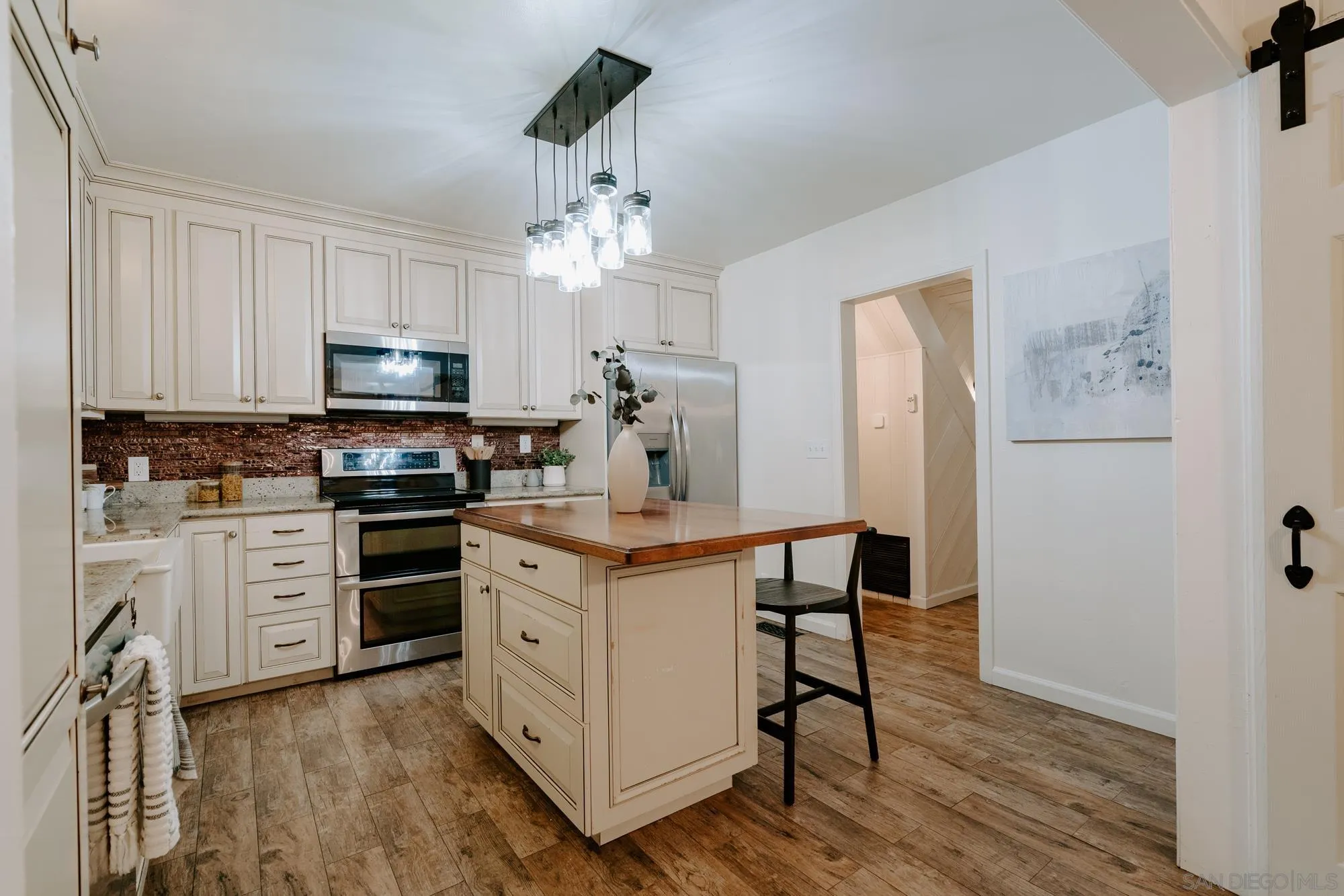 1560 South Grade Road Alpine, CA 91901 - Photo 3 of 48 a kitchen with stainless steel appliances a stove refrigerator sink and microwave