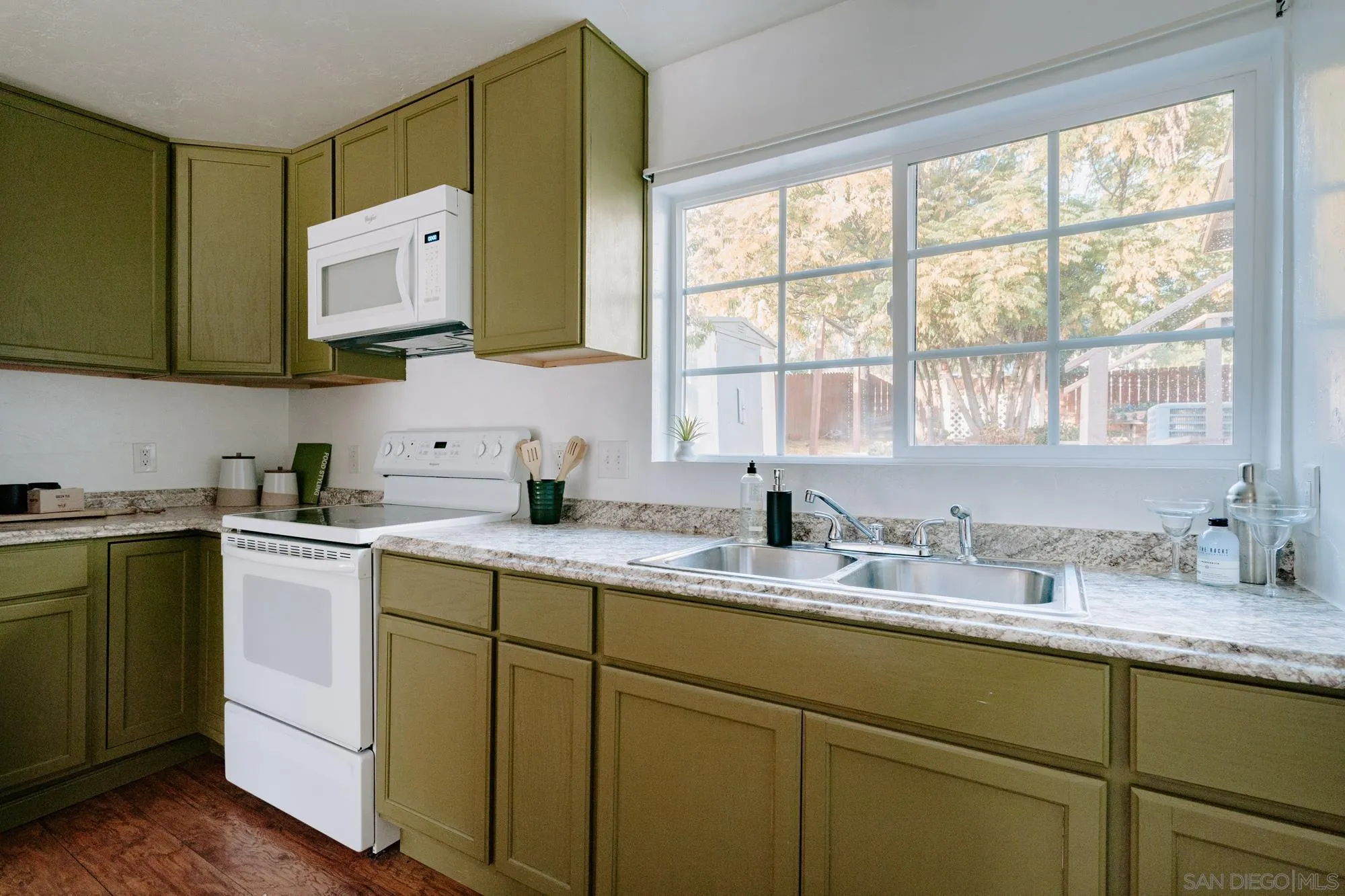 1560 South Grade Road Alpine, CA 91901 - Photo 35 of 48 a kitchen with stainless steel appliances white cabinets sink and a window
