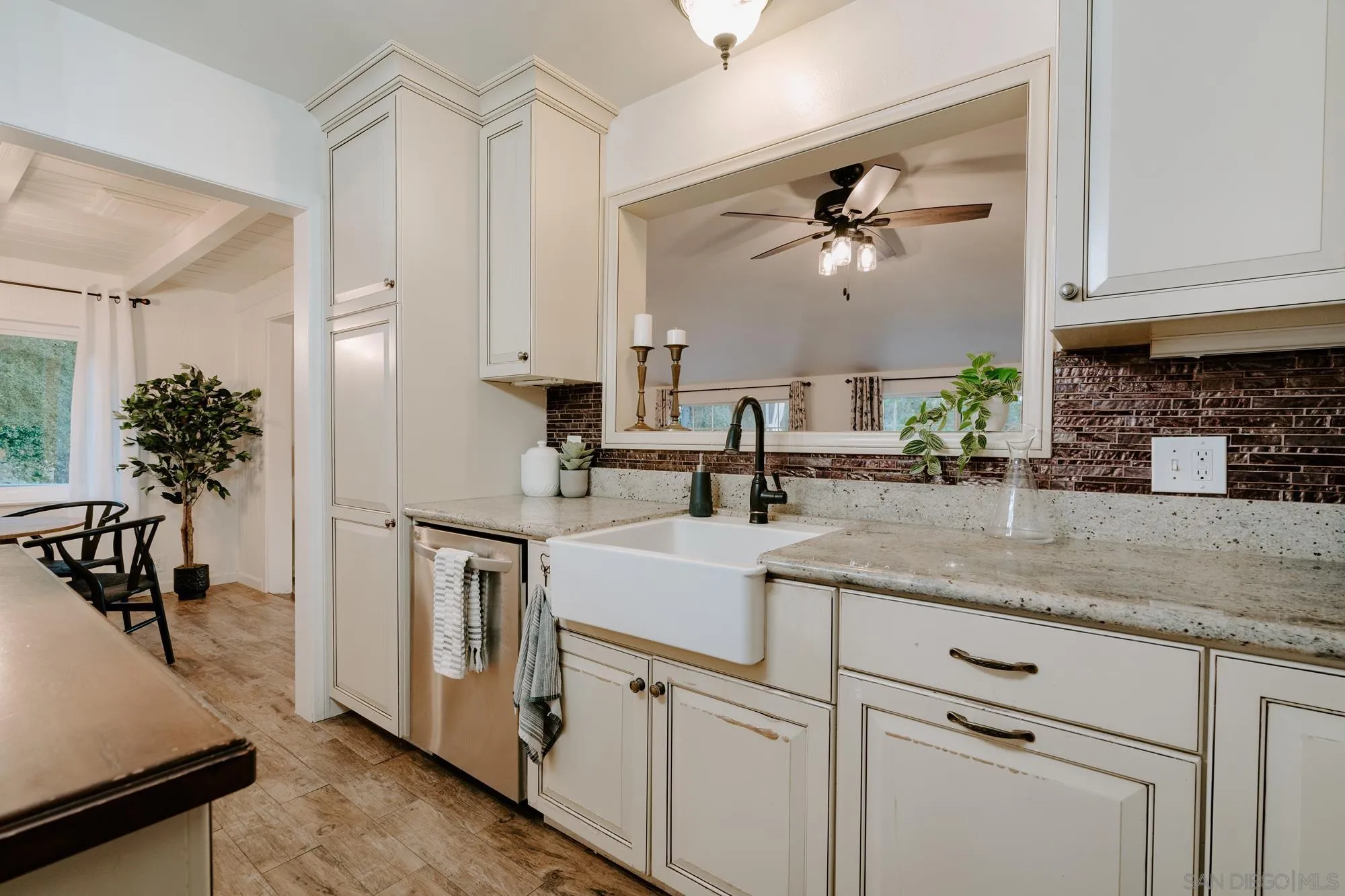 1560 South Grade Road Alpine, CA 91901 - Photo 4 of 48 a kitchen with sink cabinets and a potted plant