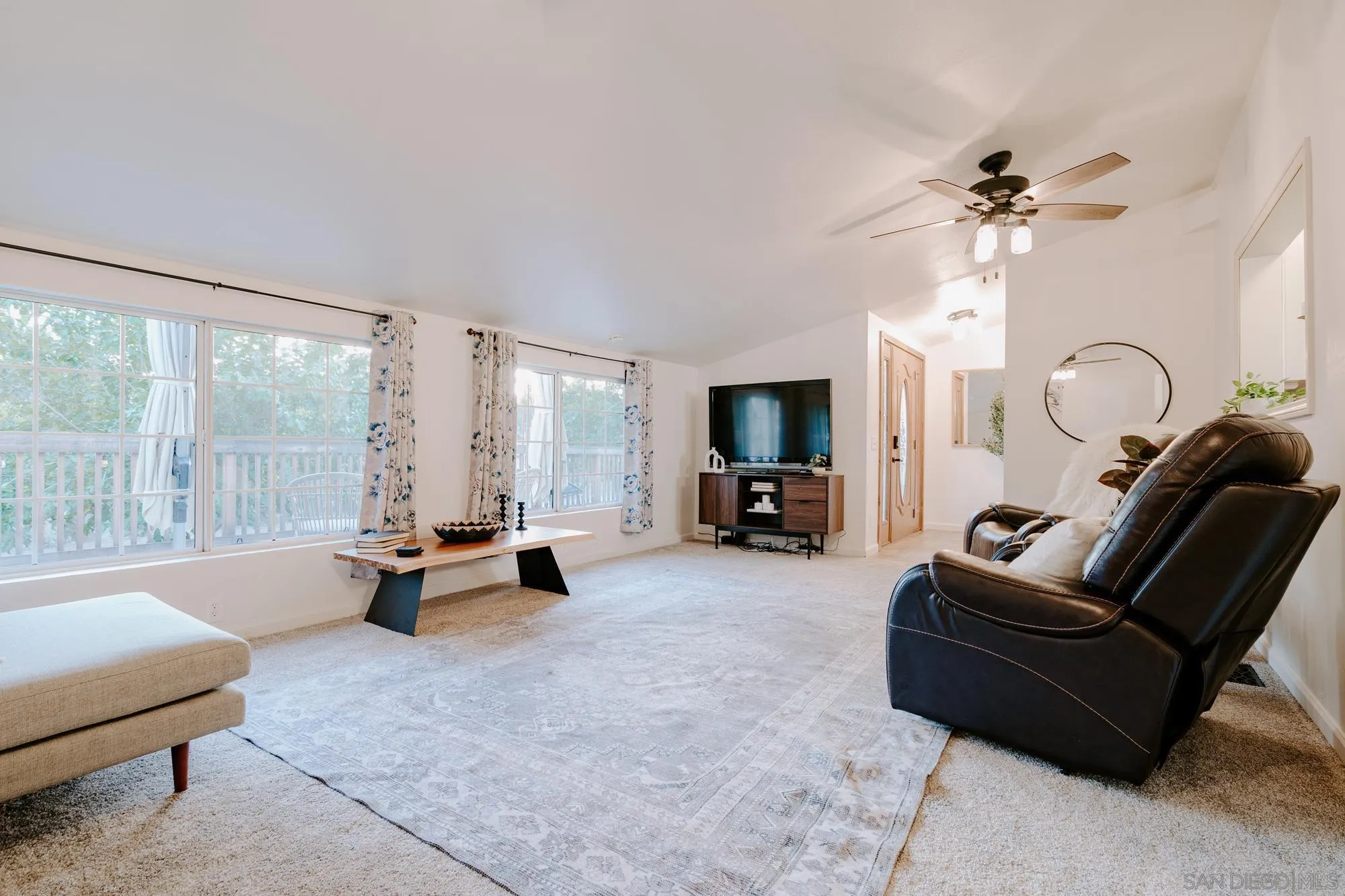 1560 South Grade Road Alpine, CA 91901 - Photo 7 of 48 a living room with furniture and a flat screen tv