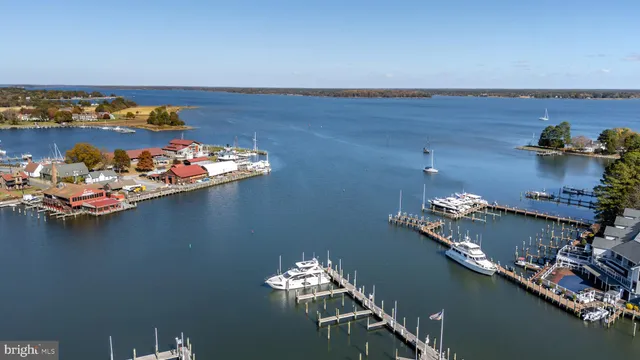 a view of a lake with a table and chairs