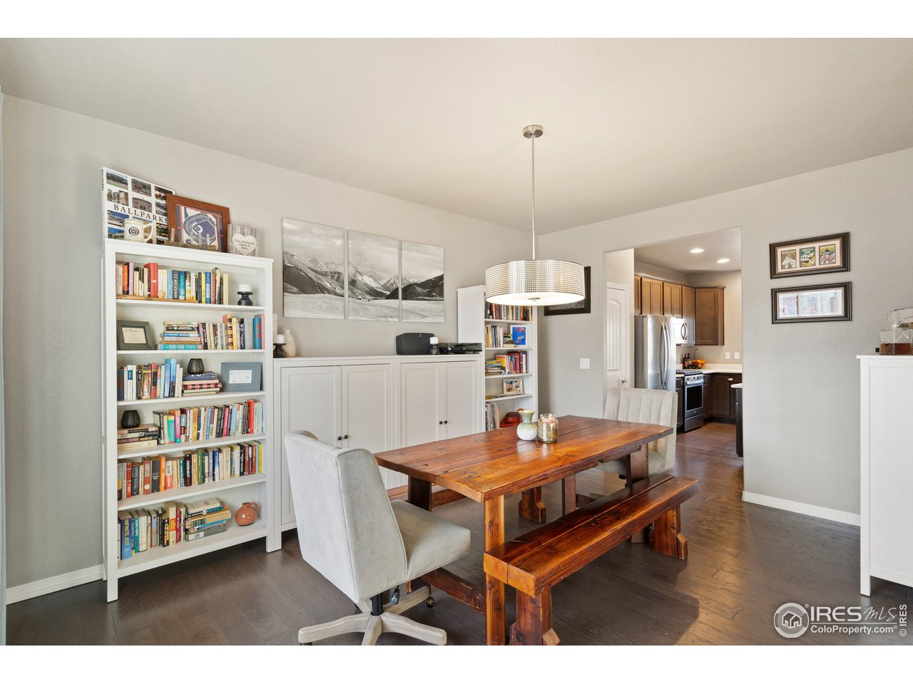 2499 Likens Drive Berthoud, CO 80513 - Photo 11 of 33 a living room with furniture a table and bookshelf
