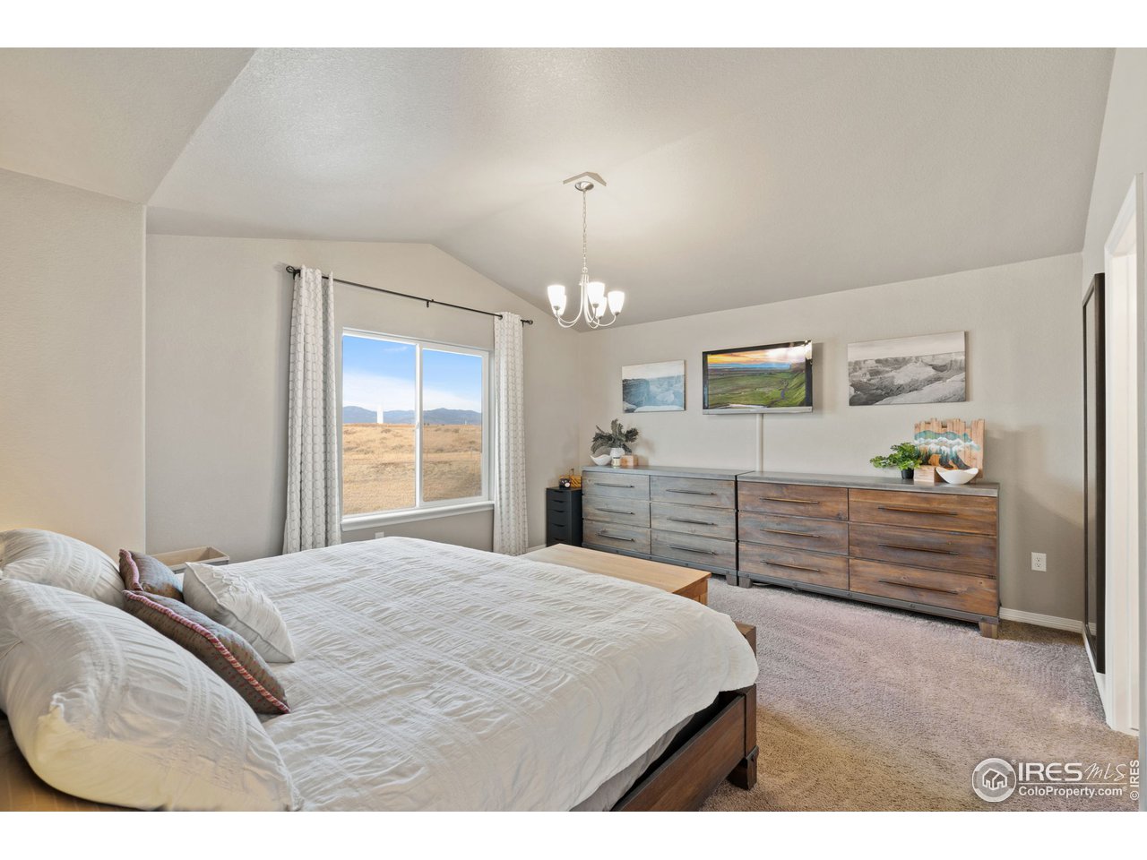 2499 Likens Drive Berthoud, CO 80513 - Photo 13 of 33 a bedroom with a bed and a dresser