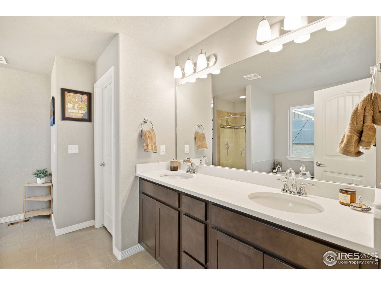 2499 Likens Drive Berthoud, CO 80513 - Photo 15 of 33 a bathroom with a sink double vanity granite and a mirror