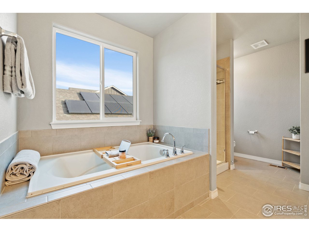 2499 Likens Drive Berthoud, CO 80513 - Photo 16 of 33 a bathroom with a tub sink and mirror