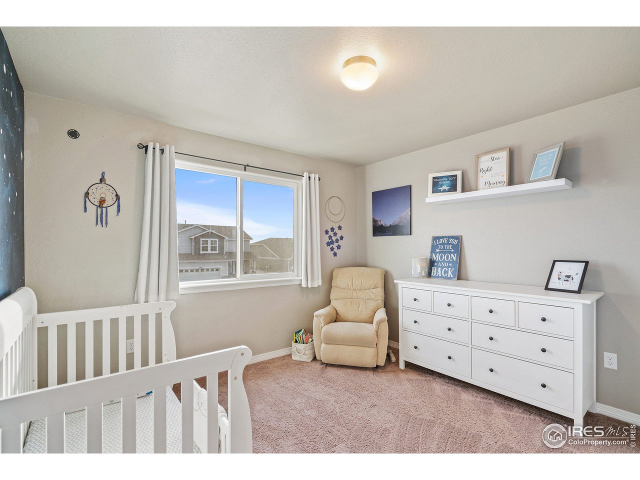 2499 Likens Drive Berthoud, CO 80513 - Photo 19 of 33 a bedroom with furniture and window