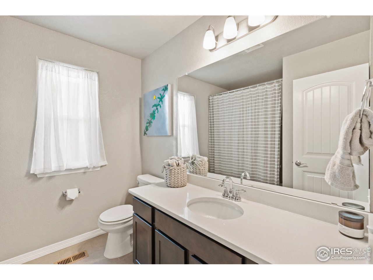 2499 Likens Drive Berthoud, CO 80513 - Photo 20 of 33 a bathroom with a sink and a toilet