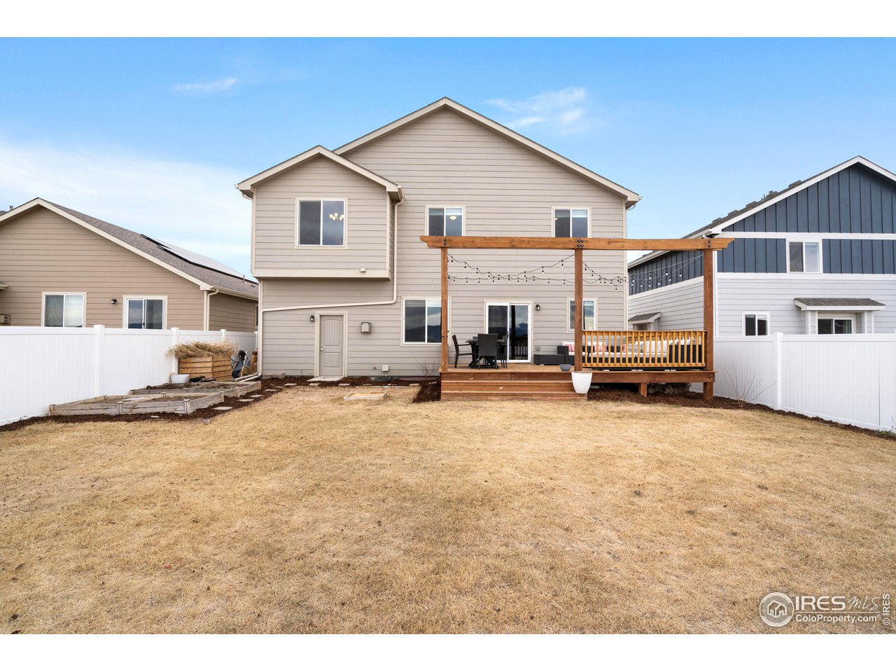 2499 Likens Drive Berthoud, CO 80513 - Photo 23 of 33 a view of a house with a big yard and large trees