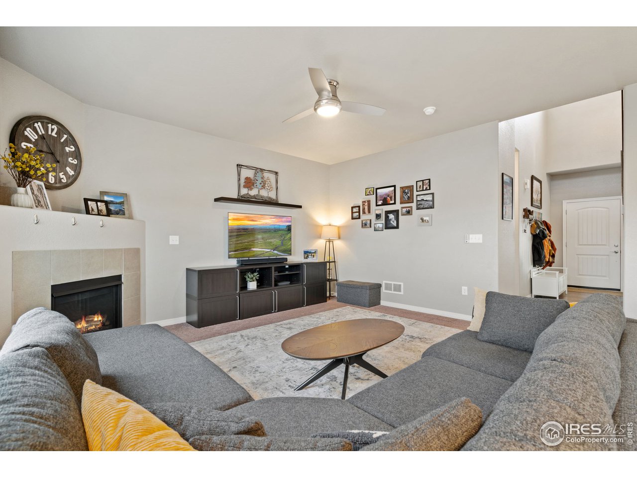 2499 Likens Drive Berthoud, CO 80513 - Photo 7 of 33 a living room with furniture and a fireplace