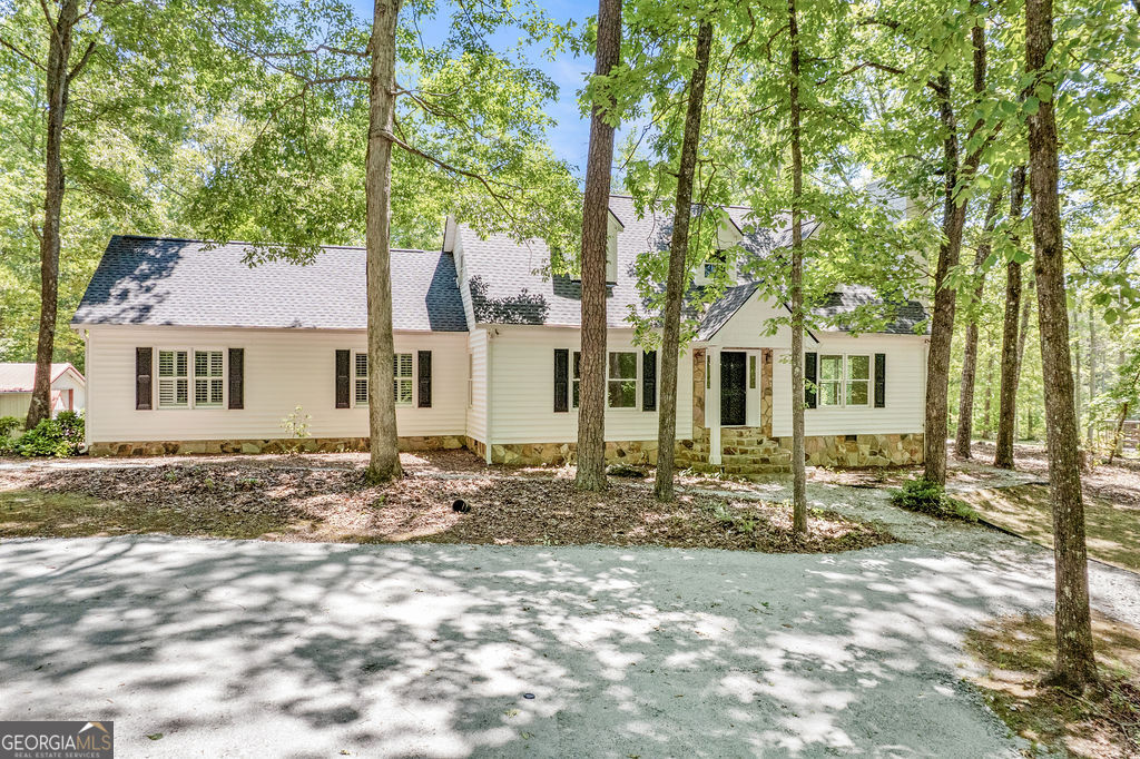 a front view of a house with yard