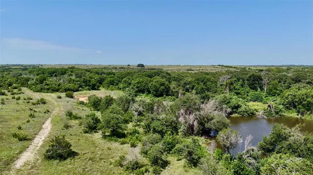a view of a lake with houses in the back