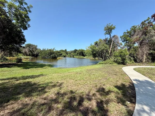 a view of a lush green space with sea