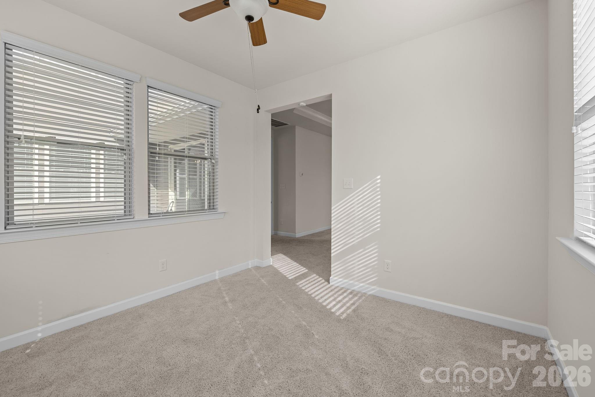 1440 Imperial Court York, SC 29745 - Photo 27 of 47 an empty room with chandelier fan and windows