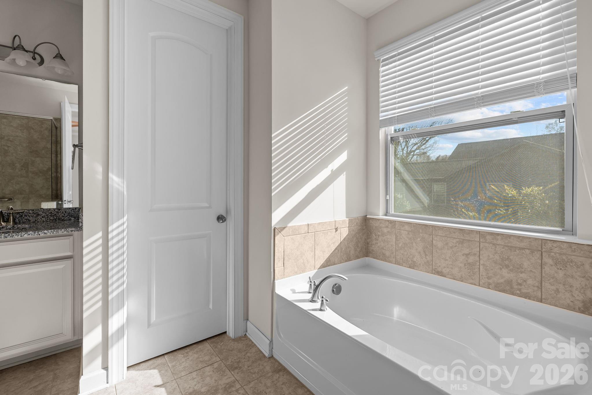 1440 Imperial Court York, SC 29745 - Photo 28 of 47 a bathroom with a tub a mirror and a window