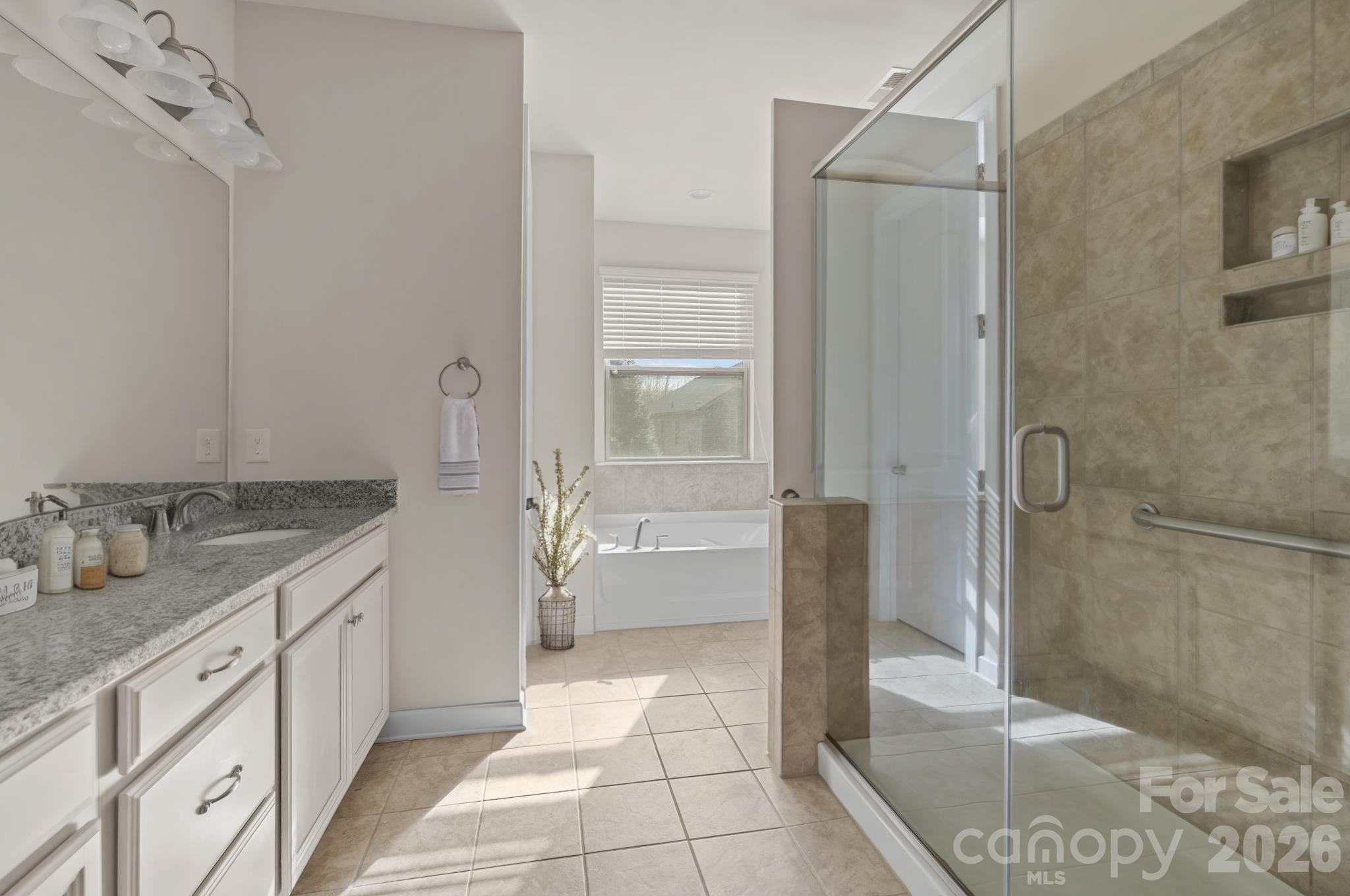 1440 Imperial Court York, SC 29745 - Photo 29 of 47 a spacious bathroom with a granite countertop sink a toilet and shower