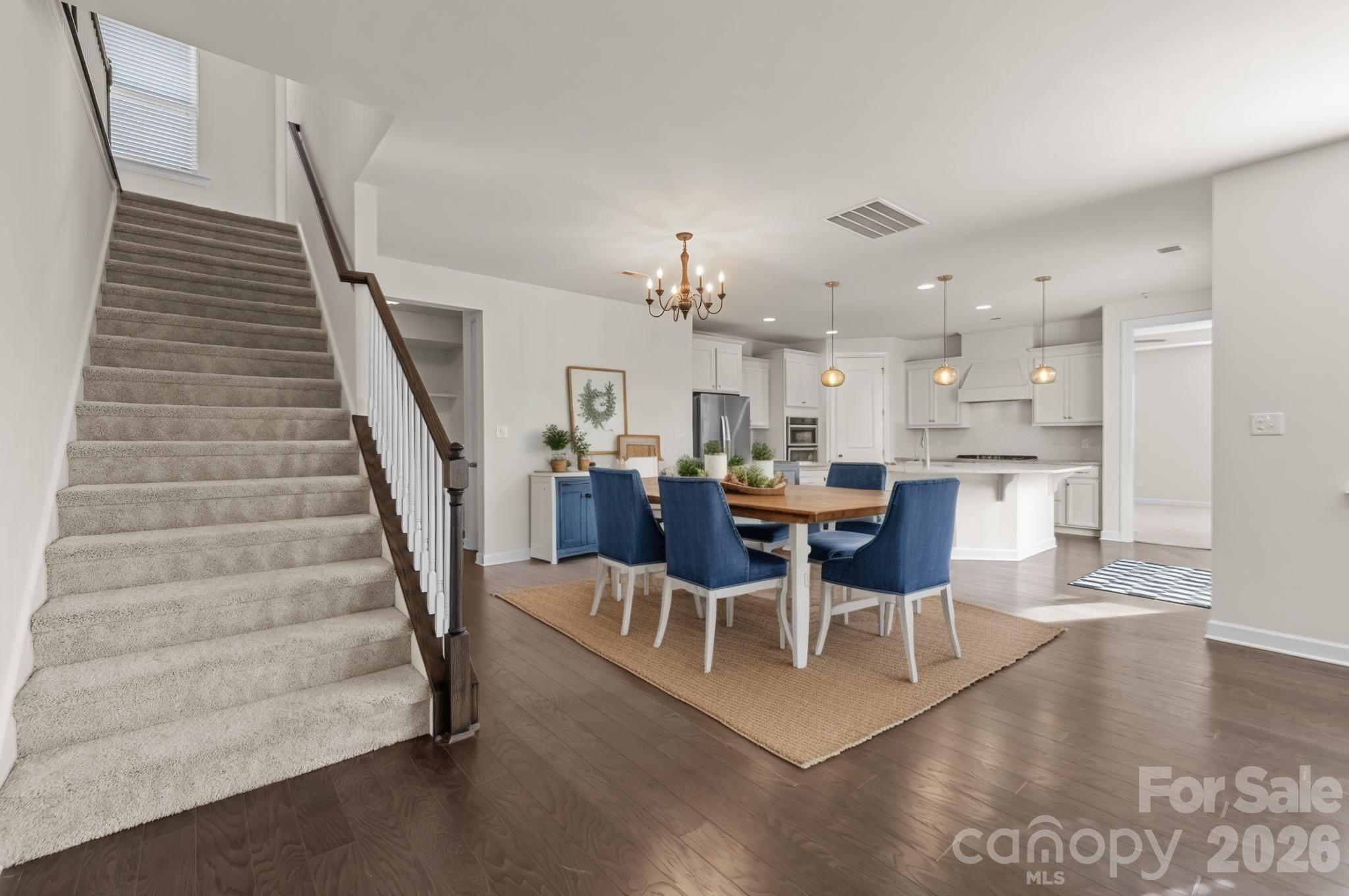 1440 Imperial Court York, SC 29745 - Photo 7 of 47 a living room with furniture and a dining table with kitchen view