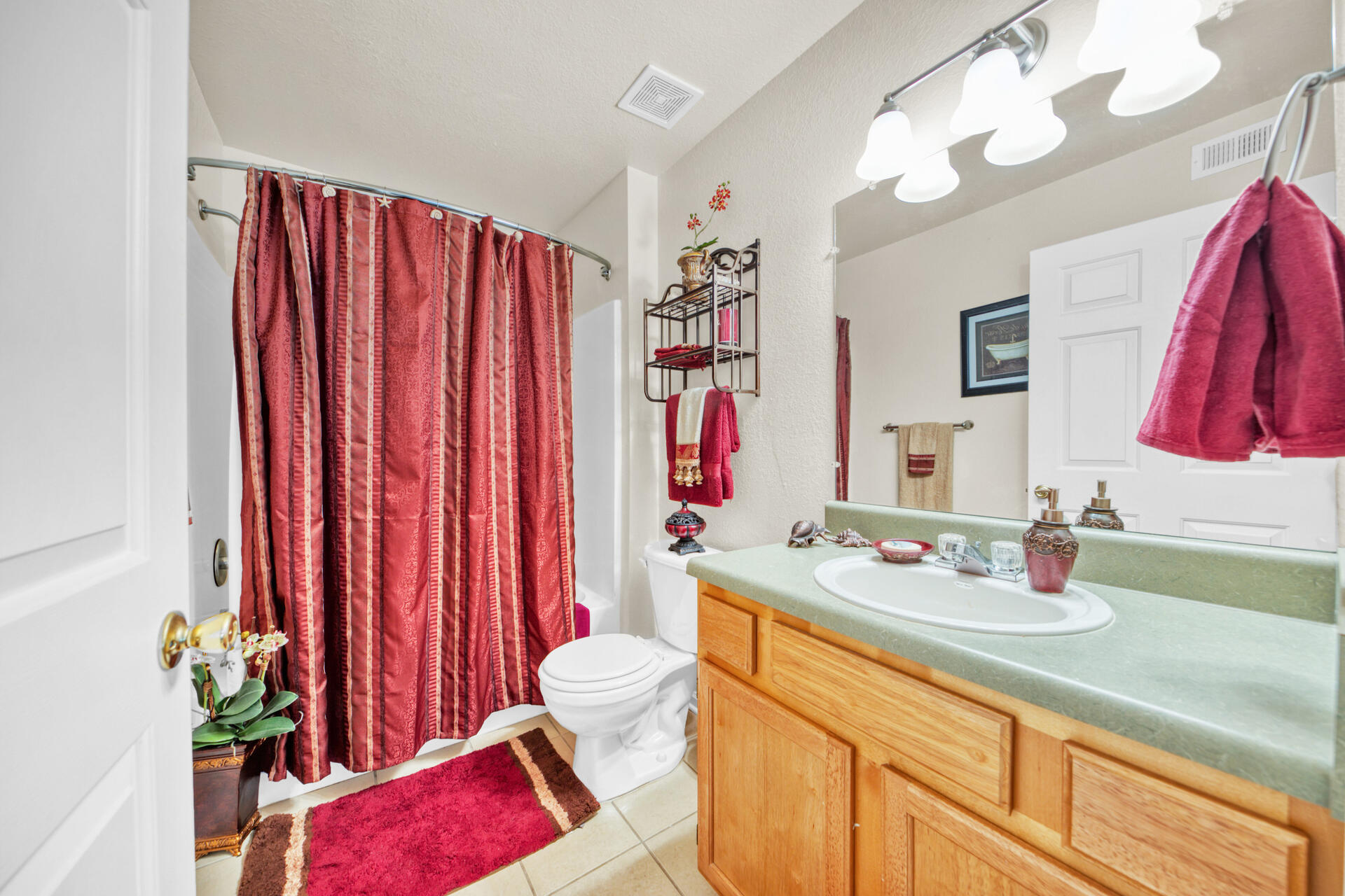 4010 Dancing Cloud Court, Unit 387 Destin, FL 32541 - Photo 12 of 20 a bathroom with a sink vanity and a mirror