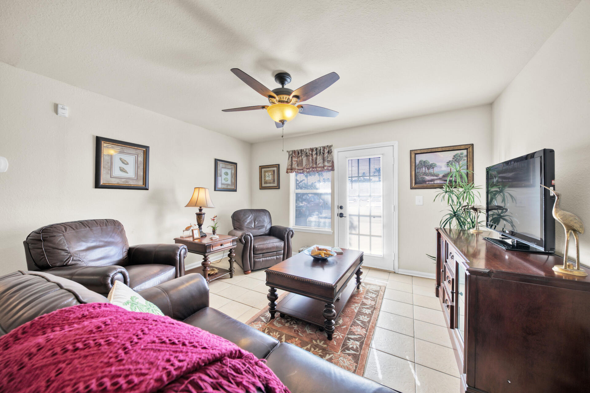 4010 Dancing Cloud Court, Unit 387 Destin, FL 32541 - Photo 4 of 20 a living room with furniture a flat screen tv and a window