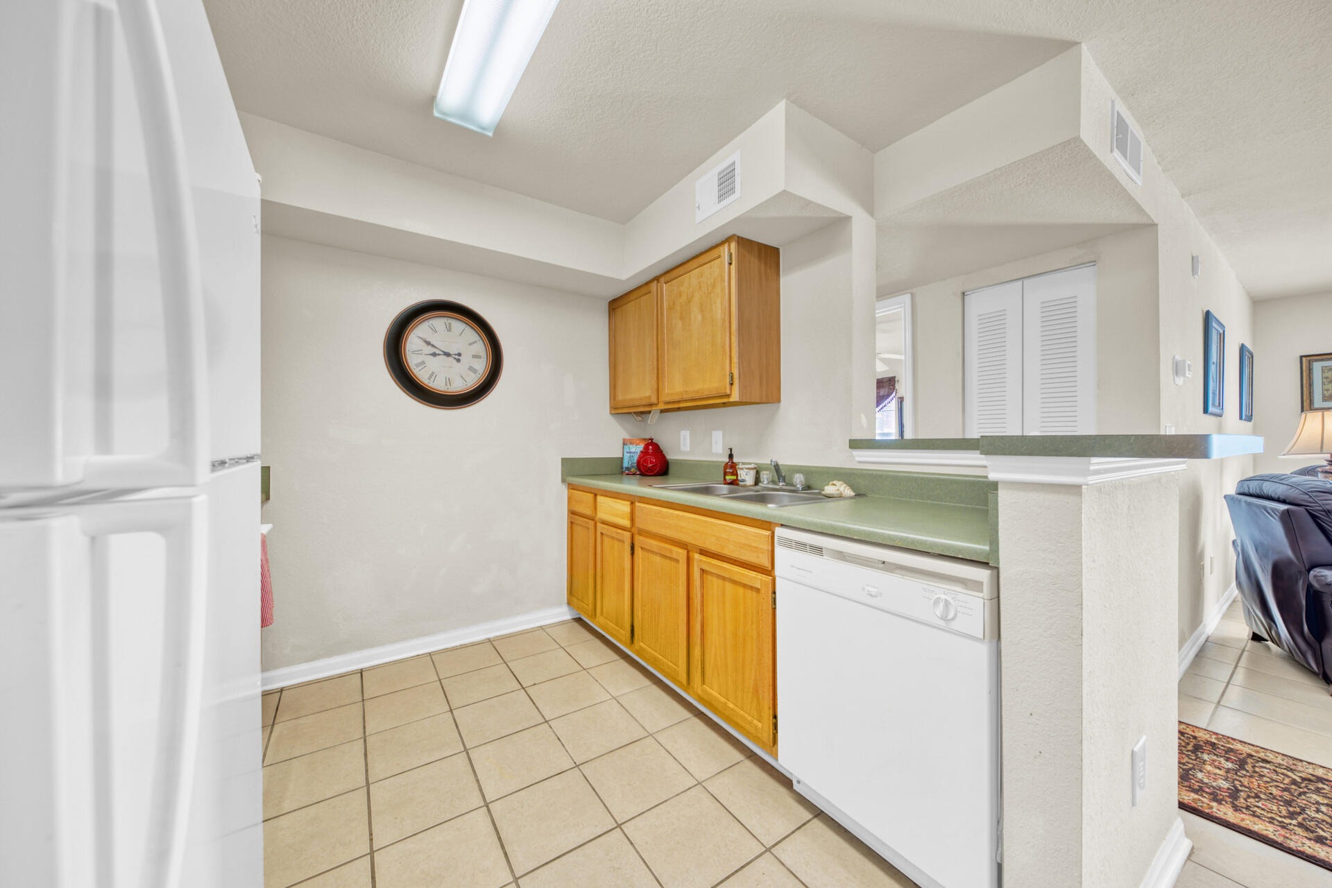 4010 Dancing Cloud Court, Unit 387 Destin, FL 32541 - Photo 8 of 20 a kitchen with a cabinets and a stove top oven