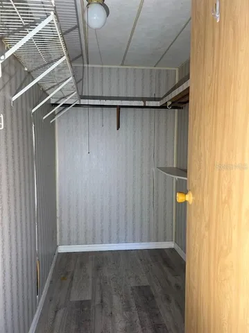 a view of a room with wooden walls