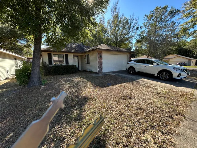 a view of a car in front of house