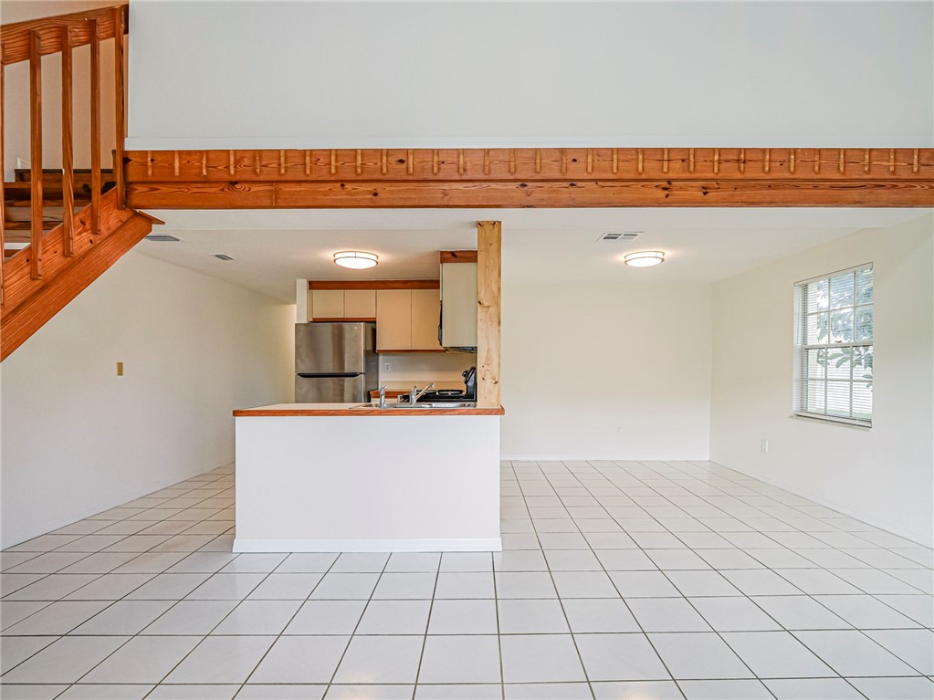 8520 Highway 1, Unit H12 Sebastian, FL 32976 - Photo 14 of 35 a view of a kitchen with kitchen furniture and a window