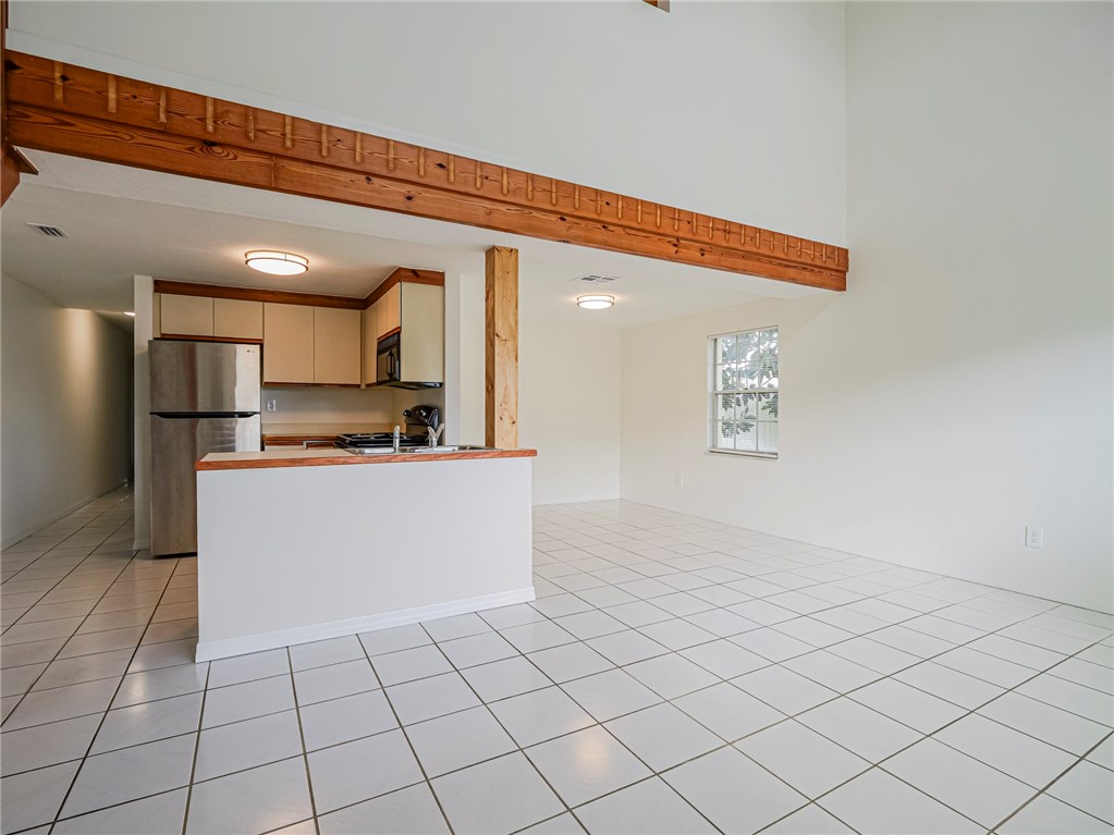 8520 Highway 1, Unit H12 Sebastian, FL 32976 - Photo 20 of 35 a view of kitchen with refrigerator cabinets and microwave