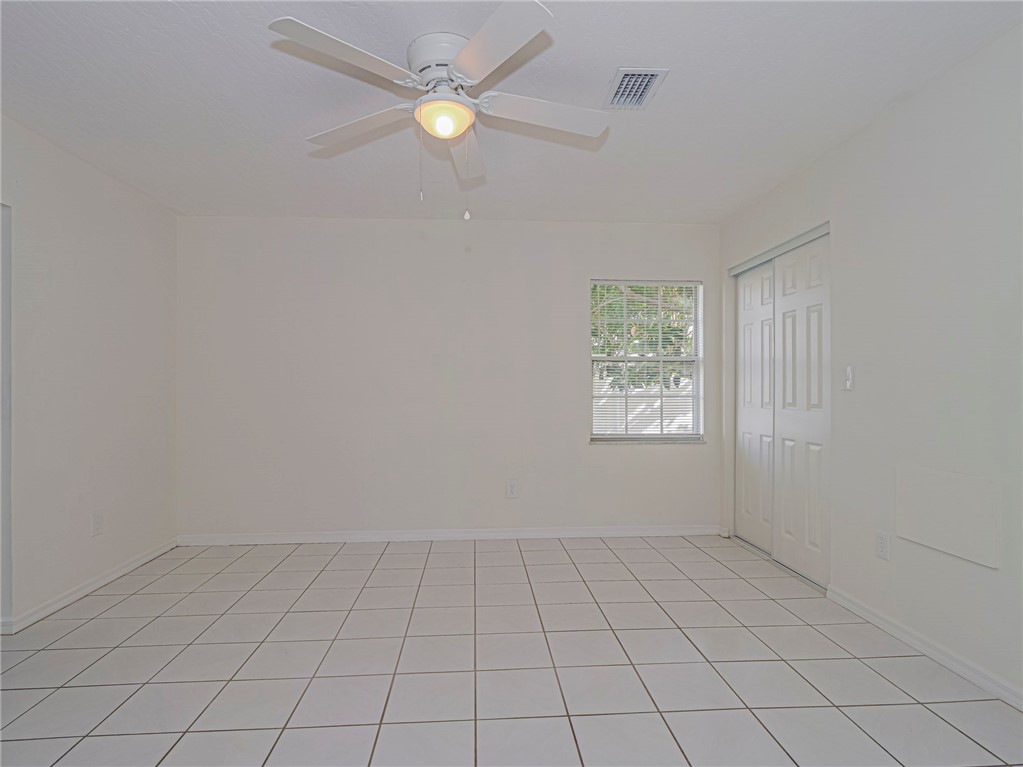 8520 Highway 1, Unit H12 Sebastian, FL 32976 - Photo 21 of 35 an empty room with windows and fan