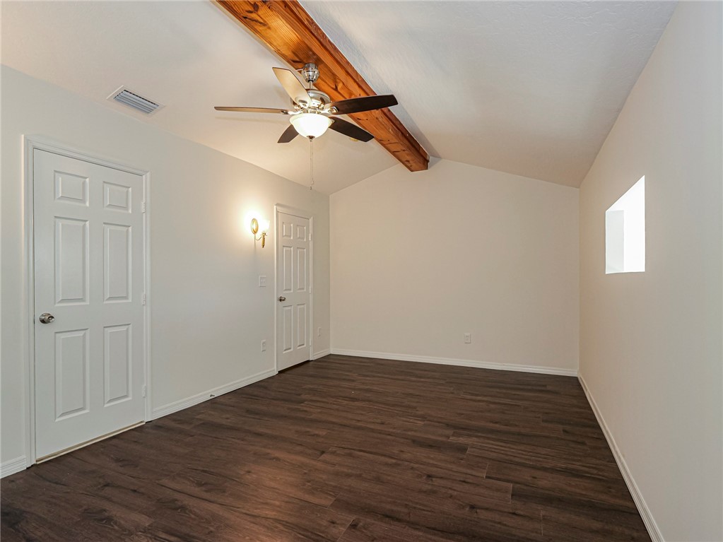 8520 Highway 1, Unit H12 Sebastian, FL 32976 - Photo 29 of 35 an empty room with wooden floor fan and windows