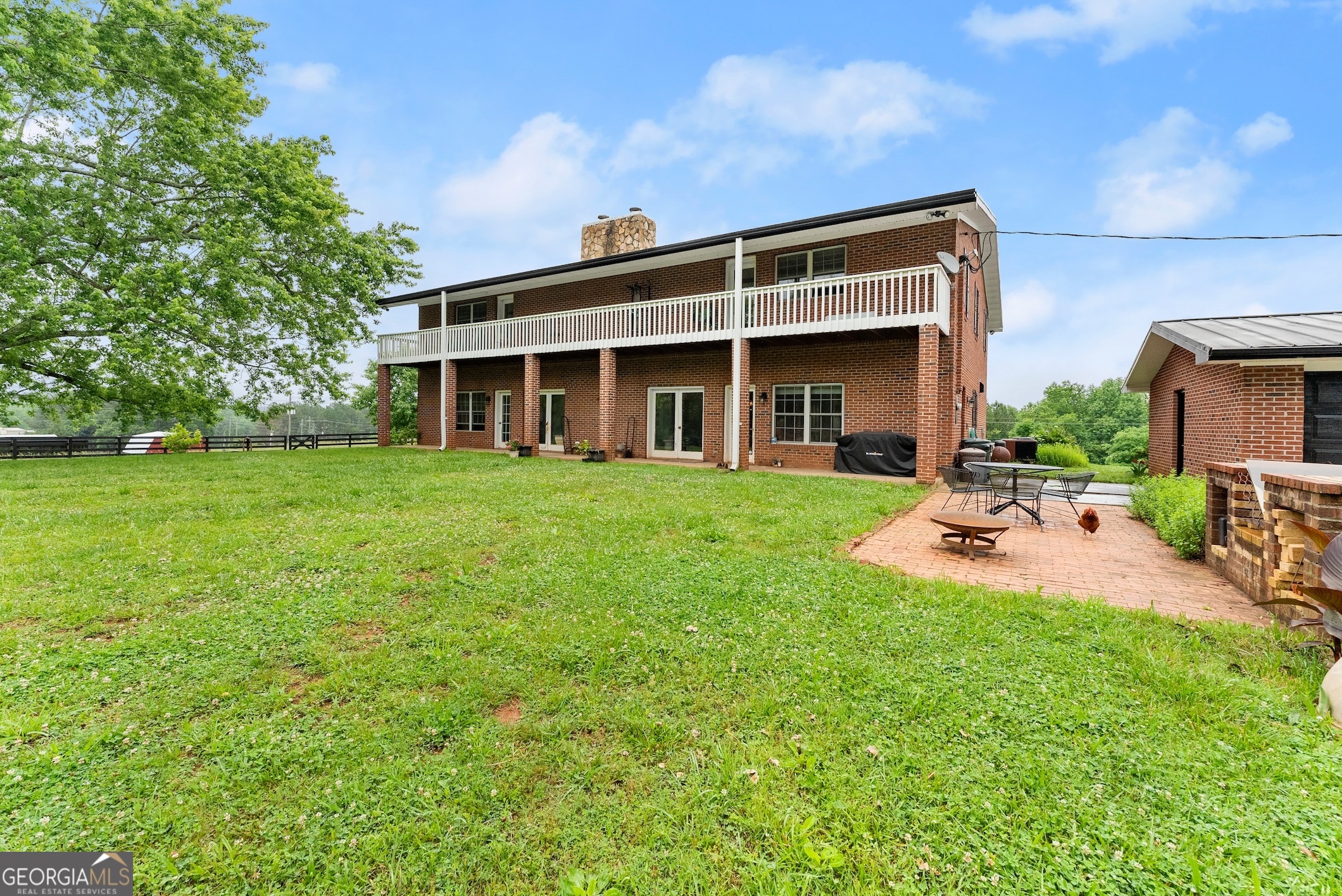 7215 Kelly Bridge Road Dawsonville, GA 30534 - Photo 46 of 81 a view of a house with backyard porch and sitting area