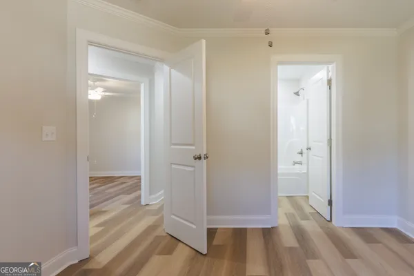 a view of a bathroom with wooden floor