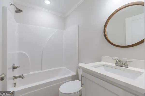 a bathroom with a sink a toilet and a bathtub