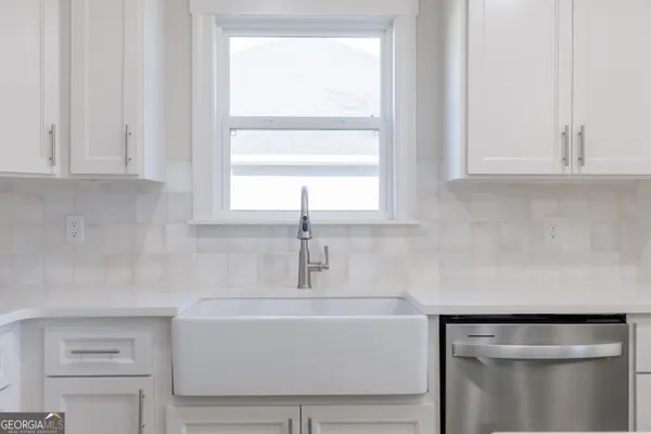 a bathroom with a sink and a window