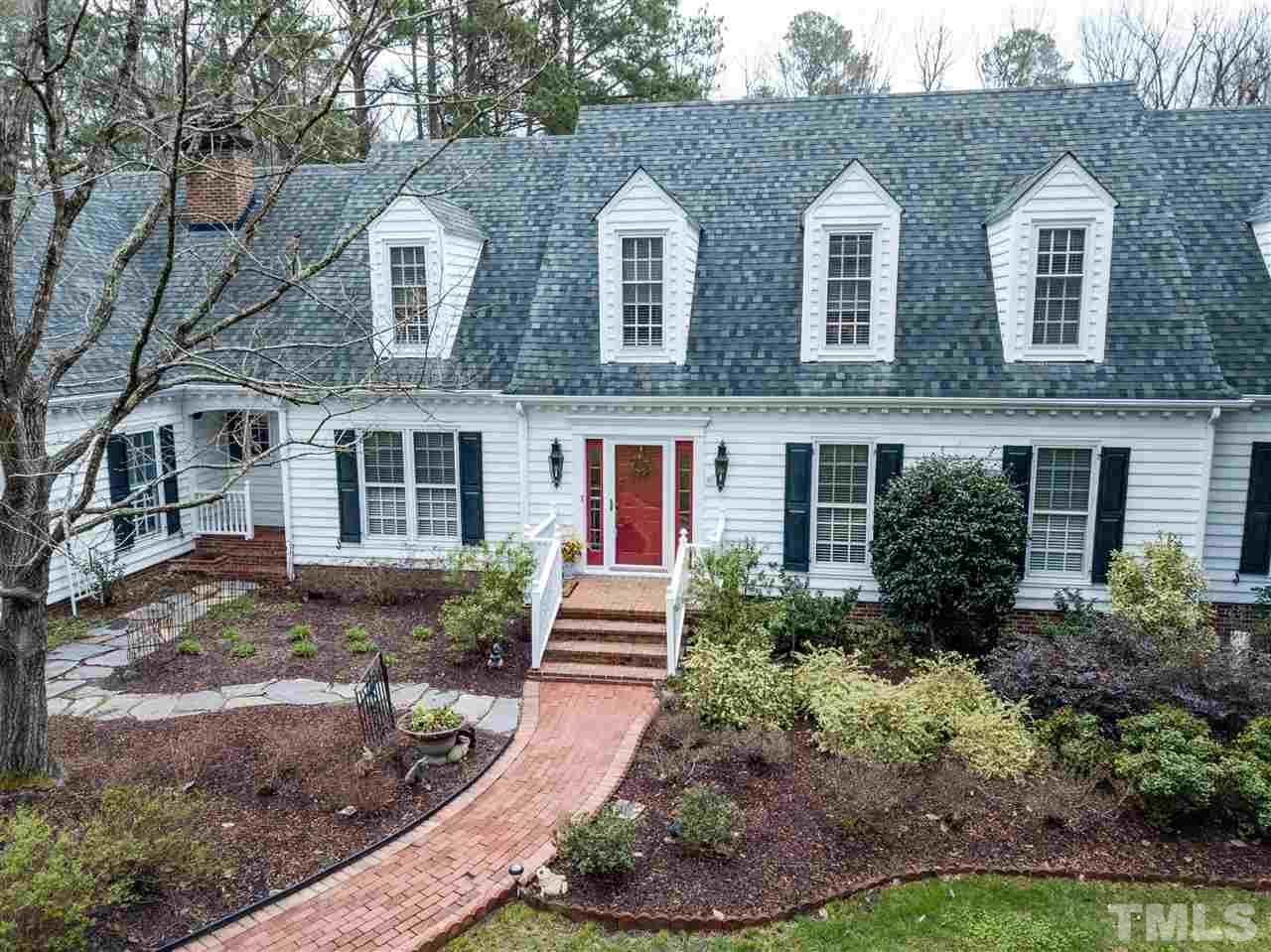 1000 Arrow Leaf Circle Cary, NC 27519 - Photo 1 of 25 a front view of a house with garden and porch