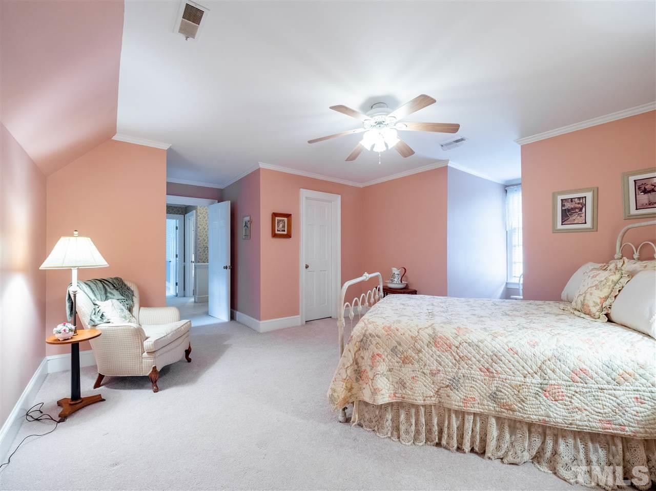 1000 Arrow Leaf Circle Cary, NC 27519 - Photo 16 of 25 a bedroom with a bed and a chandelier
