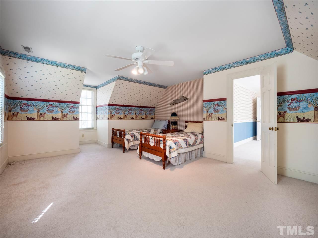 1000 Arrow Leaf Circle Cary, NC 27519 - Photo 19 of 25 a living room with furniture and a chandelier