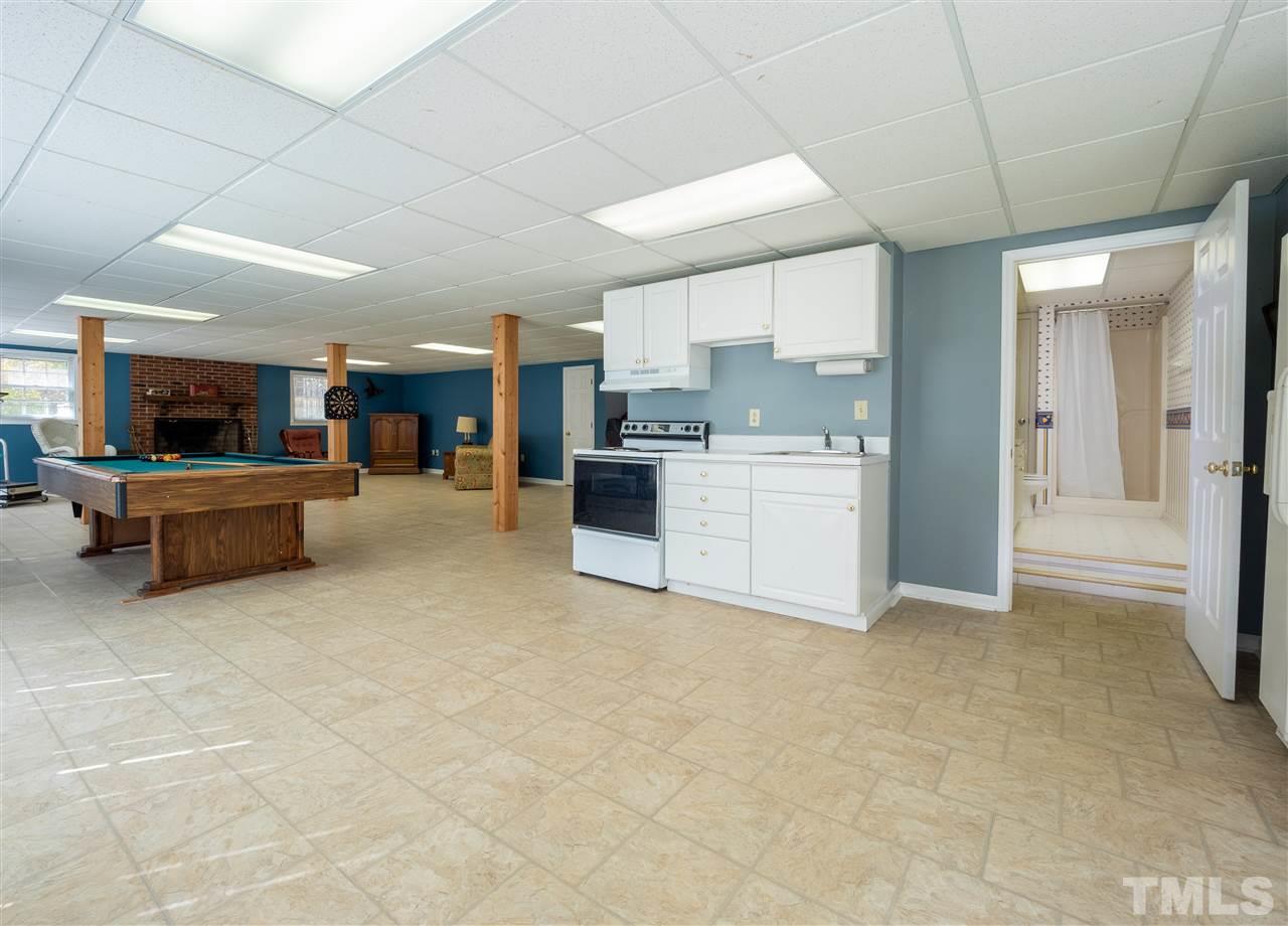 1000 Arrow Leaf Circle Cary, NC 27519 - Photo 24 of 25 a large white kitchen with a large window