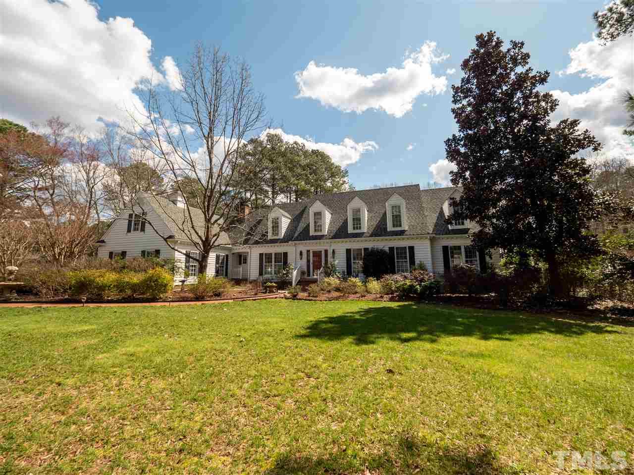 1000 Arrow Leaf Circle Cary, NC 27519 - Photo 9 of 25 a view of a house with a big yard and large trees