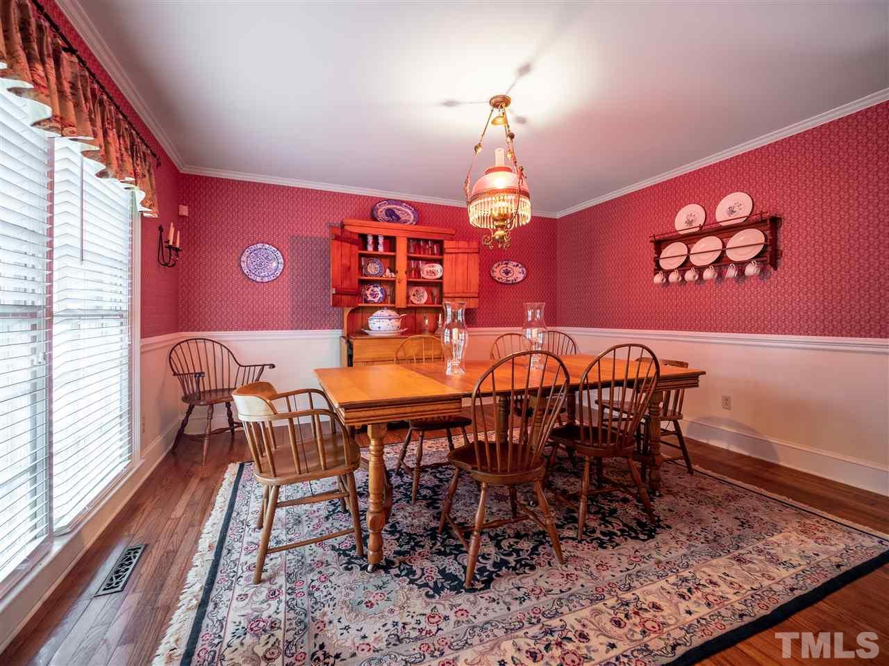 1000 Arrow Leaf Circle Cary, NC 27519 - Photo 10 of 25 a view of a dining room with furniture window and wooden floor