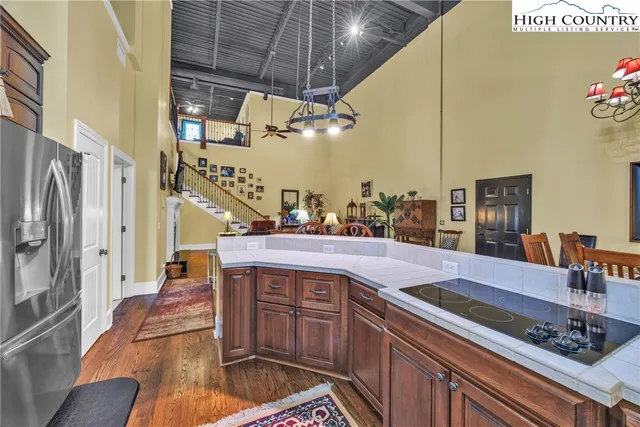 a kitchen with stainless steel appliances granite countertop a sink and cabinets